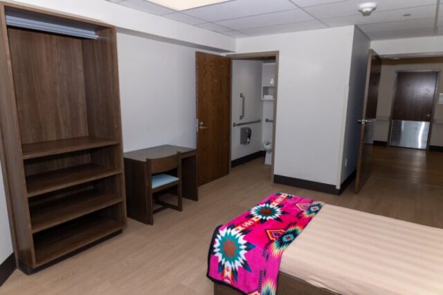 Each residential patient room includes a private bathroom and personal storage space.